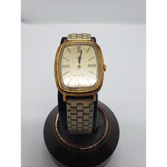 Timex Men's watch. Gold face and band. Stainless steel back